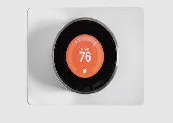 Mister Sparky Houston Electrician shows an energy efficient thermostat
