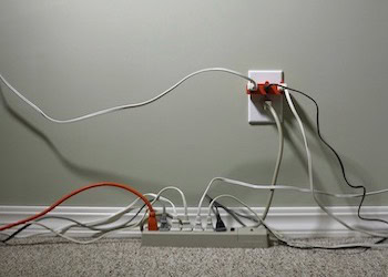 Mister Sparky Houston Electrician shows an energy efficient wall outlet Mister Sparky Houston Electrician shows an energy efficient wall outlet